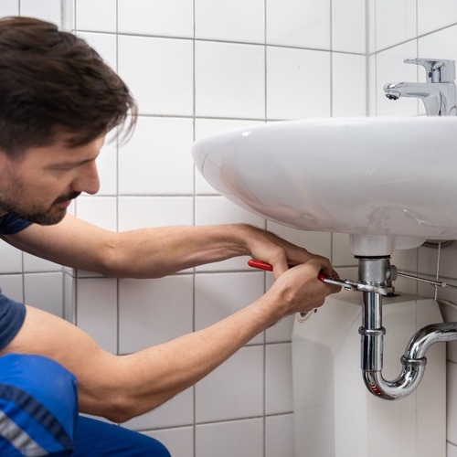 A Plumber Provides Sink Repair